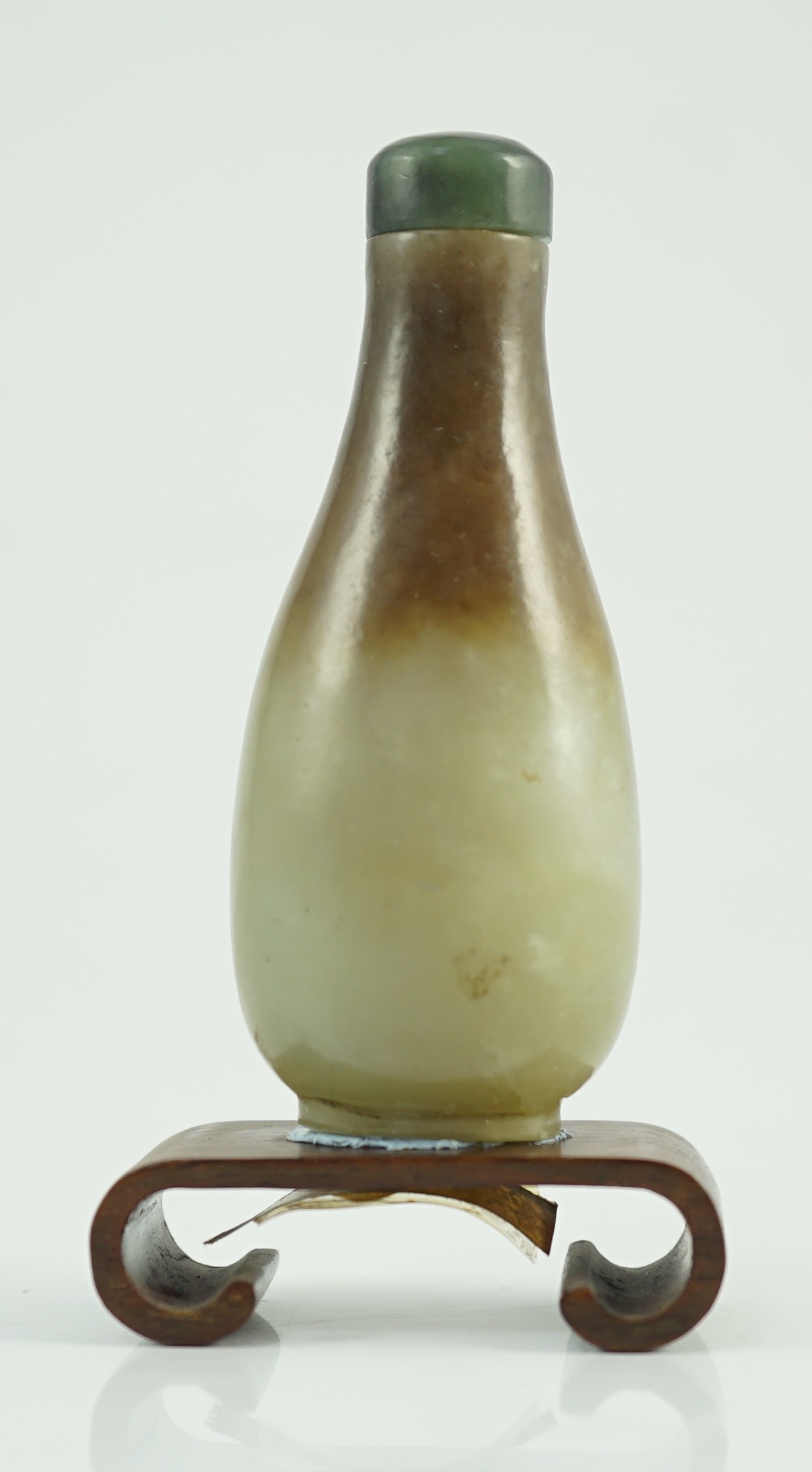 A Chinese celadon and brown jade pear form snuff bottle, 19th century, 7.2cm high